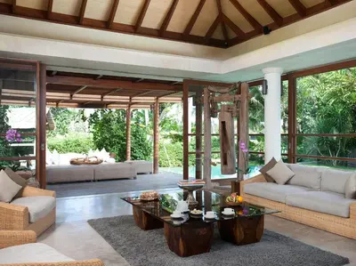 a living room with two couches and a table at Dea Villas in Canggu