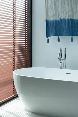 a bathroom with a white sink and a window at Villa Talisman - Stylish Canggu with Rooftop Villa 5 mins to Beach in Canggu