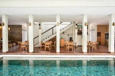 a view of the pool and dining room of a hotel at Sedasa Lodge in Canggu
