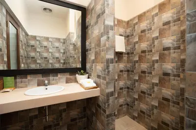a bathroom with a sink and a mirror at Sedasa Lodge in Canggu