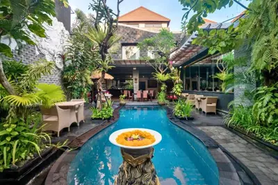 a pool at a resort with a bowl of food on a fountain at Bramanty 2 BR Private Pool Villa in Seminyak