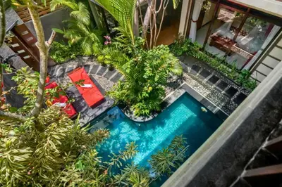 an overhead view of a swimming pool with plants at Catra 3 BR Private Pool Villa in Seminyak
