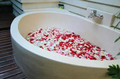 a bath tub full of sprinkles in a bathroom at Kastara 4 BR Private Pool Villa in Seminyak