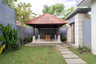 a gazebo in the backyard of a house at Kings Villas Sanur by Moria in Denpasar