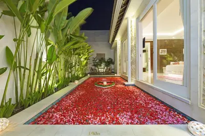 a room with a red carpet on the floor at Bajra Bali Villa Seminyak in Seminyak