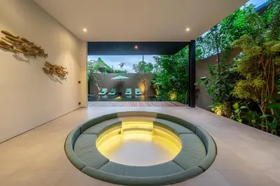 an indoor garden with a circular room in a house at The Continental Modern Luxury 4 BR Villa in Seminyak Central in Seminyak