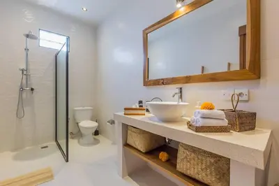 a bathroom with a sink and a shower at Villa Lima - 5 bdrs, BBQ, Living room with Ac and private pool in Seminyak