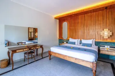 a bedroom with a bed and a desk and a desk at Luxury 3BR Private Pool Villa in Seminyak