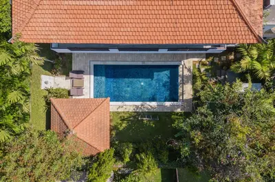 an overhead view of a swimming pool with an orange roof at Luxury 3BR Private Pool Villa in Seminyak