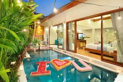 a house with a pool with a bed and a bedroom at Beautiful 1BR Private Pool Villa in Seminyak
