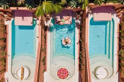 an overhead view of a pool at a theme park at Modern 1BR Private Pool Villa With Bathtub in Seminyak