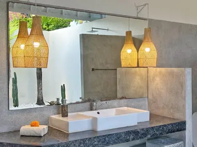 a bathroom with a white sink and a mirror at Fully renovated villa 3BR in Seminyak - Oberoi in Seminyak