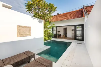 a swimming pool in the backyard of a villa at Villa Jabula in Seminyak