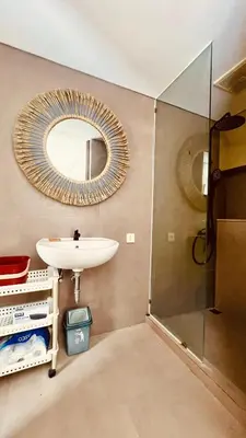 a bathroom with a sink and a mirror at Oasis Villa Canggu in Kerobokan