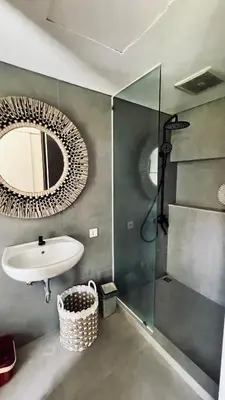 a bathroom with a sink and a mirror at Oasis Villa Canggu in Kerobokan