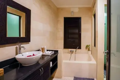 a bathroom with a sink and a bath tub and a sink at Villa Narada - Convenient Location - Private Pool - 3BR Villa in Seminyak