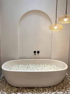 a white bath tub sitting on a counter with two lights at Villa EL NIS - LEGIAN - 4 Bedroom - 4 Bathroom - Luxury in Legian
