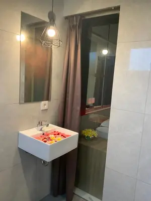 a bathroom with a sink and a mirror at Bali queen elephant boutique villa in Jimbaran
