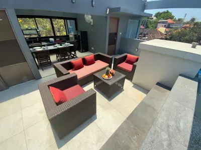an aerial view of a living room with red pillows at Bali queen elephant boutique villa in Jimbaran