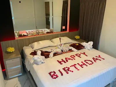 a bed with a happy christmas written on it at Bali queen elephant boutique villa in Jimbaran