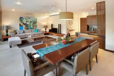 a living room with a dining table and a couch at Cozy 2 BR Private Pool Villa in Seminyak