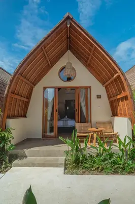 a house with a round roof with a patio at Abian Klumpu Villa & Spa Sanur Bali in Sanur