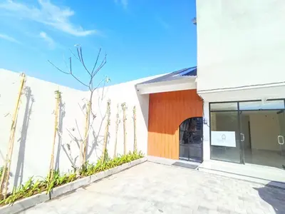 a facade of a white building with a fence at Abian Klumpu Villa & Spa Sanur Bali in Sanur