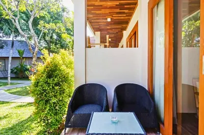 a table and two chairs on a porch at Luxury 1 BR Deluxe Twin Room in Canggu