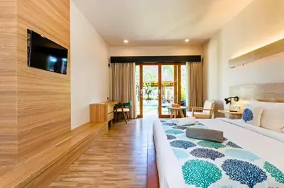 a hotel room with two beds and a television at Luxury 1 BR Deluxe Twin Room in Canggu