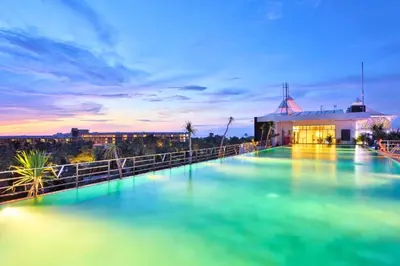 a pool of water in front of a building at Damarlangit 1 BR Superior Terrace in Seminyak