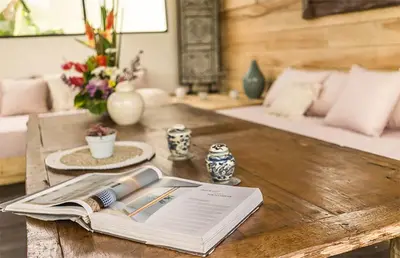 a table with an open book on top of it at Villa Kosibali by Optimum Bali Villas in Kerobokan