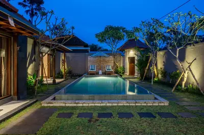 a swimming pool in the backyard of a house at Villa MD 2 Stylish 3 BR w/ Sunny Pool at Prime Eat Street in Seminyak