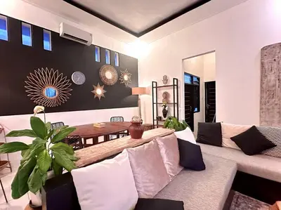 a living room with a couch and a table at 2 BR Villa Rhapsody - 5 Mins to Seminyak/Umalas in Seminyak