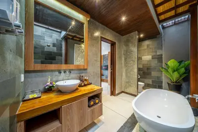 a bathroom with a sink and a bath tub at Villa MD Tranquil 6BR Villa at Eat Street in Seminyak