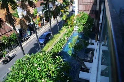 an aerial view of a street with palm trees and a car at Destiny Boutique Hotel in Seminyak