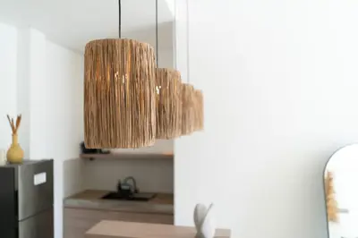 a pendant light hanging over a table in a kitchen at Villa Arawan - Beautiful 3BR Villa in Kerobokan in Kerobokan