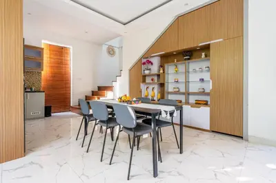 a kitchen and dining room with a table and chairs at Villa Sun Lila by JB Villas in Seminyak
