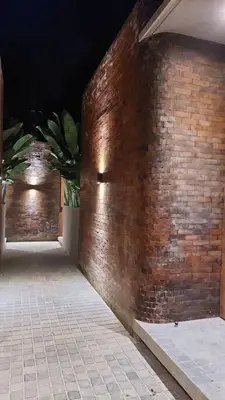a brick wall with a door in a building at Akhila 1 - 1 BR modern tropical villa at the heart of Seminyak in Seminyak
