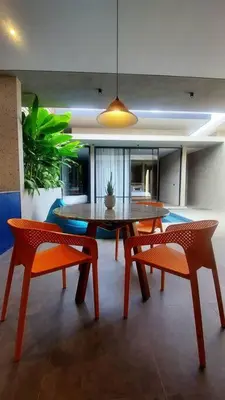 a dining room with a table and two chairs at Akhila 1 - 1 BR modern tropical villa at the heart of Seminyak in Seminyak