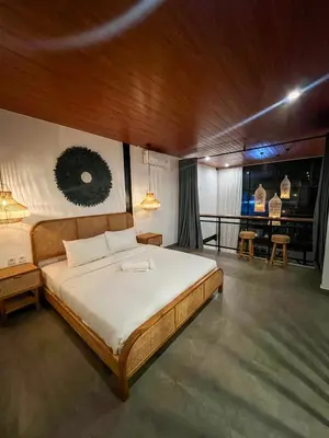 a bedroom with a large bed in a room at Tropical Loft Steps Away from the Beach! Hidden GEM! in Canggu