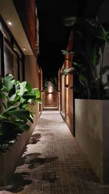 an empty hallway with plants on the side of a building at Akhila 5 - 1 BR modern tropical villa at the heart of Seminyak in Seminyak