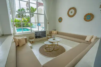 a living room with a couch and a table at Stunning tropical 3bed Villa in Canggu