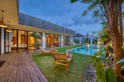 an exterior view of a house with a swimming pool at Chic Tranquility Modern yet Timeless 3BD Villa in Canggu