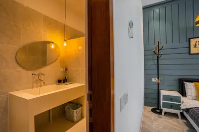 a bathroom with a sink and a mirror at NEW! Villa Sony 2 - 3BR villa next to Legian Beach in Seminyak
