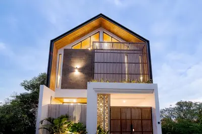 a modern house with a large window at Vin Villa Seminyak 2BR with Private Pool in Seminyak