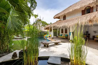 a resort with a swimming pool and a building at Rose 2BR Private Pool Villa in Kerobokan