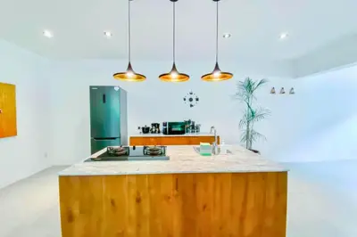 a kitchen with a wooden counter top and a refrigerator at Luxury 2 BR Private Pool Villa ZN101 in Seminyak