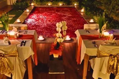 a table set up for a wedding with candles and flowers at Dahlia Mentari 2 BR Private Pool Villa in Seminyak
