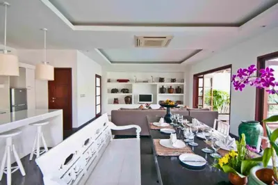 a kitchen and dining room with a table and chairs at Cozy 2 BR Private Pool Villa in Seminyak