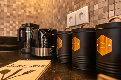 a row of black coffee pots sitting on a counter at Cosy Traditional and Fresh 2 BD Sunterrace Villa with Pvt Pool in Kerobokan